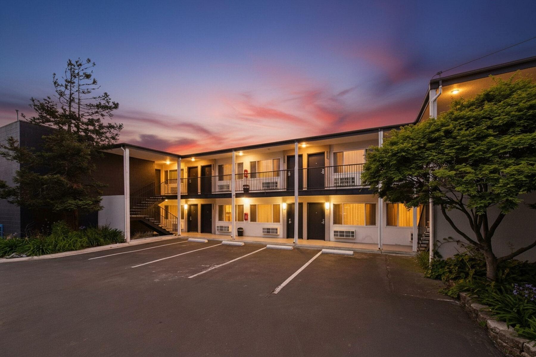 The motel at twilight under a pink sky